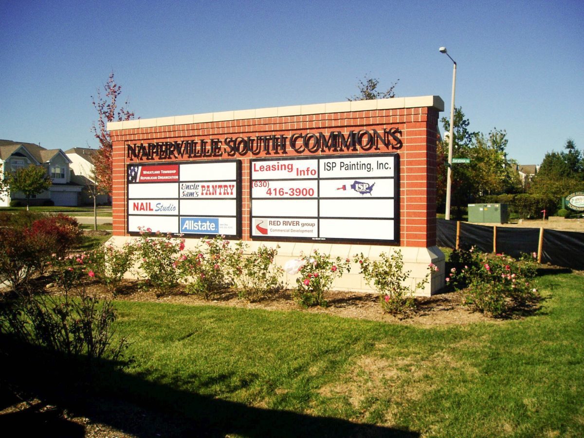 A monument sign with the names and logos of multiples business, representing how one can benefit from calling a Chicago sign company.