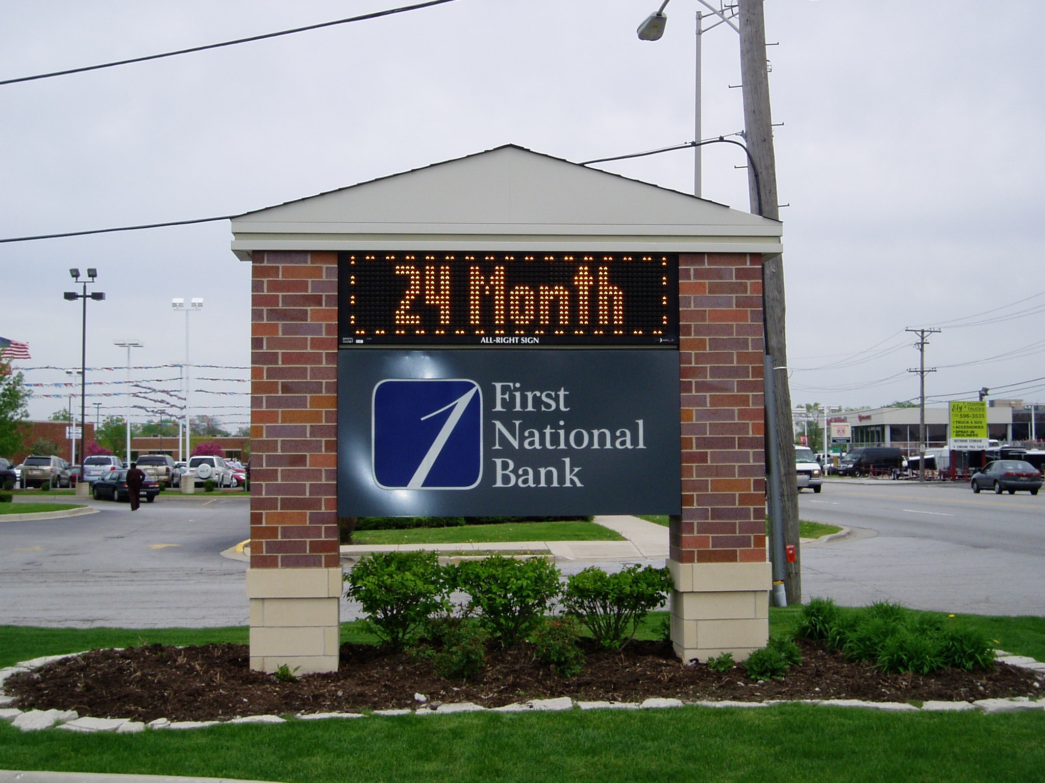 A monument, digital sign outside of a bank, representing how one can benefit from calling a Tinley Park commercial sign company.