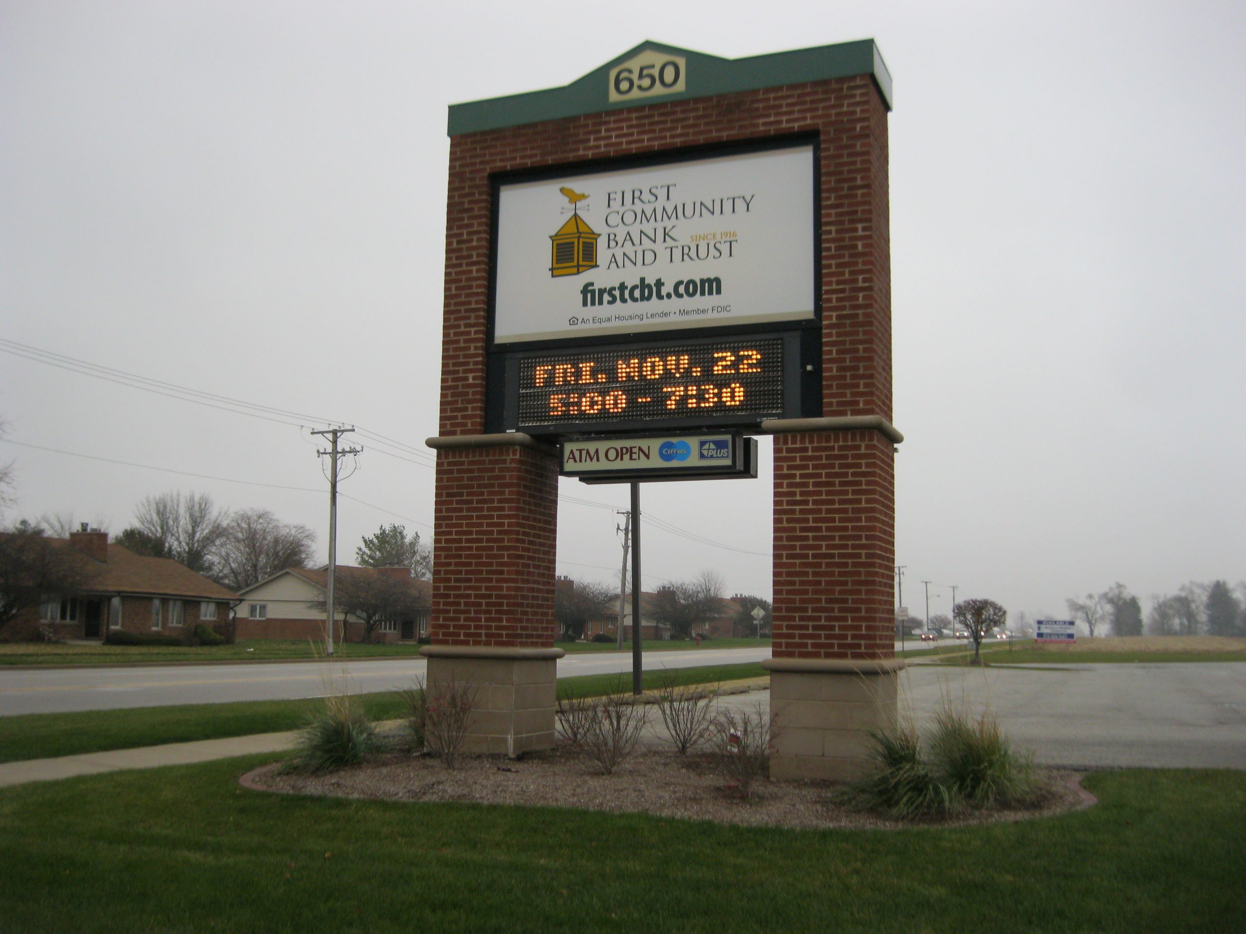 A large, monument, digital sign in a parking lot, representing how one can benefit from calling a Joliet digital sign company.