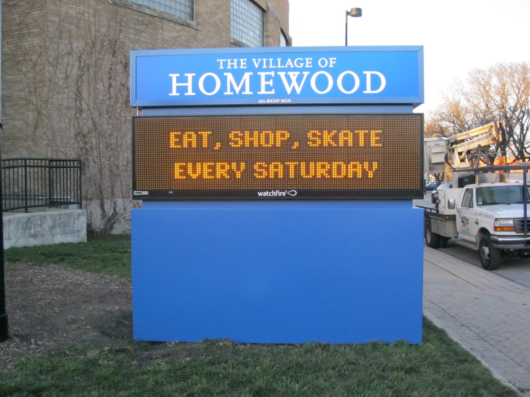A monument, digital sign with a blue frame outside of a business, representing how one can benefit from calling a Cook County, IL digital sign company.
