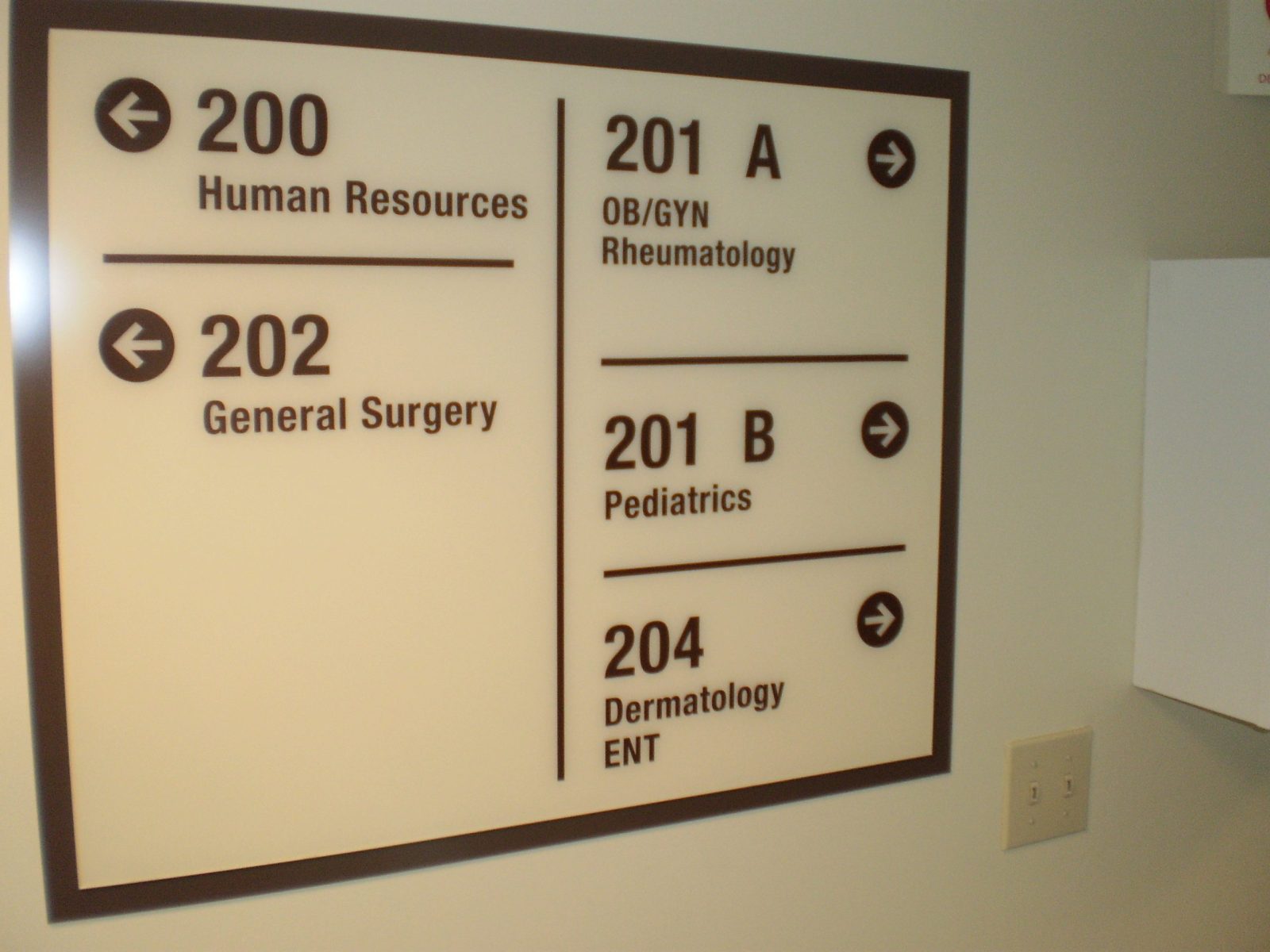 An interior sign in a hospital giving directions about where units are, representing how one can benefit from calling a sing company in Plainfield, IL.
