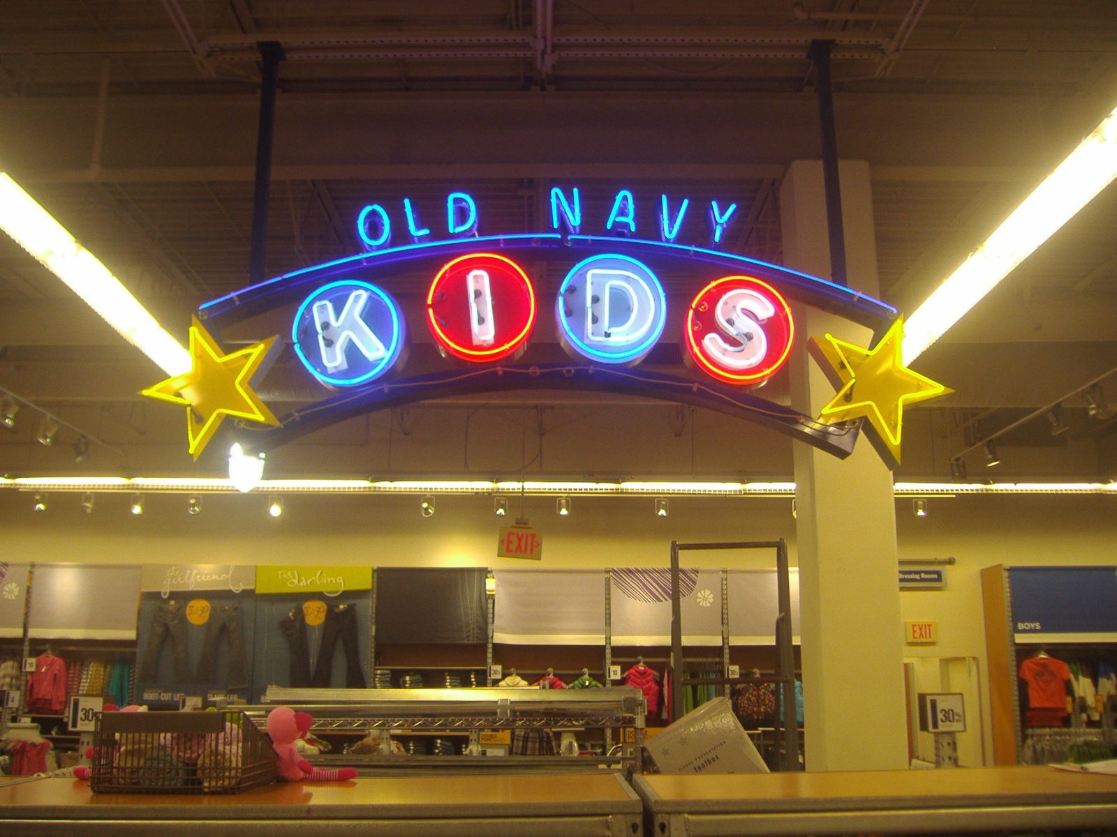 A multicolor, indoor, LED sign at a clothing store, representing how one can benefit from calling a Chicago LED signs company.
