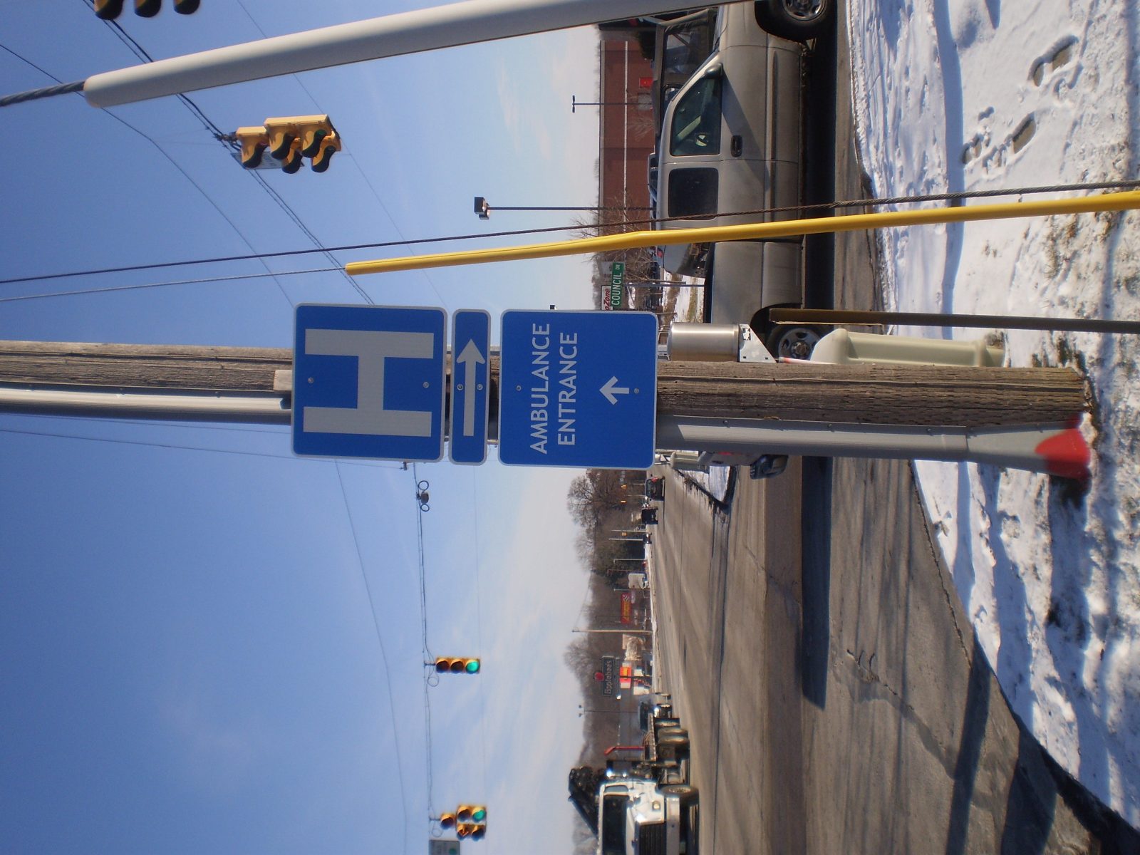 A blue post sign with white letters giving instructions to drivers, representing how one can benefit from calling a Tinley Park sign company.