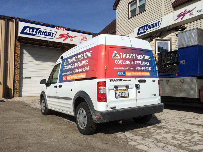 A white van with large and colorful graphic fleet, representing how one can benefit from calling a Plainfield, IL commercial truck lettering company.