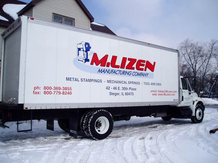 A white commercial truck with big graphic fleet, representing how one can benefit from calling a Schererville, IN commercial truck lettering company.