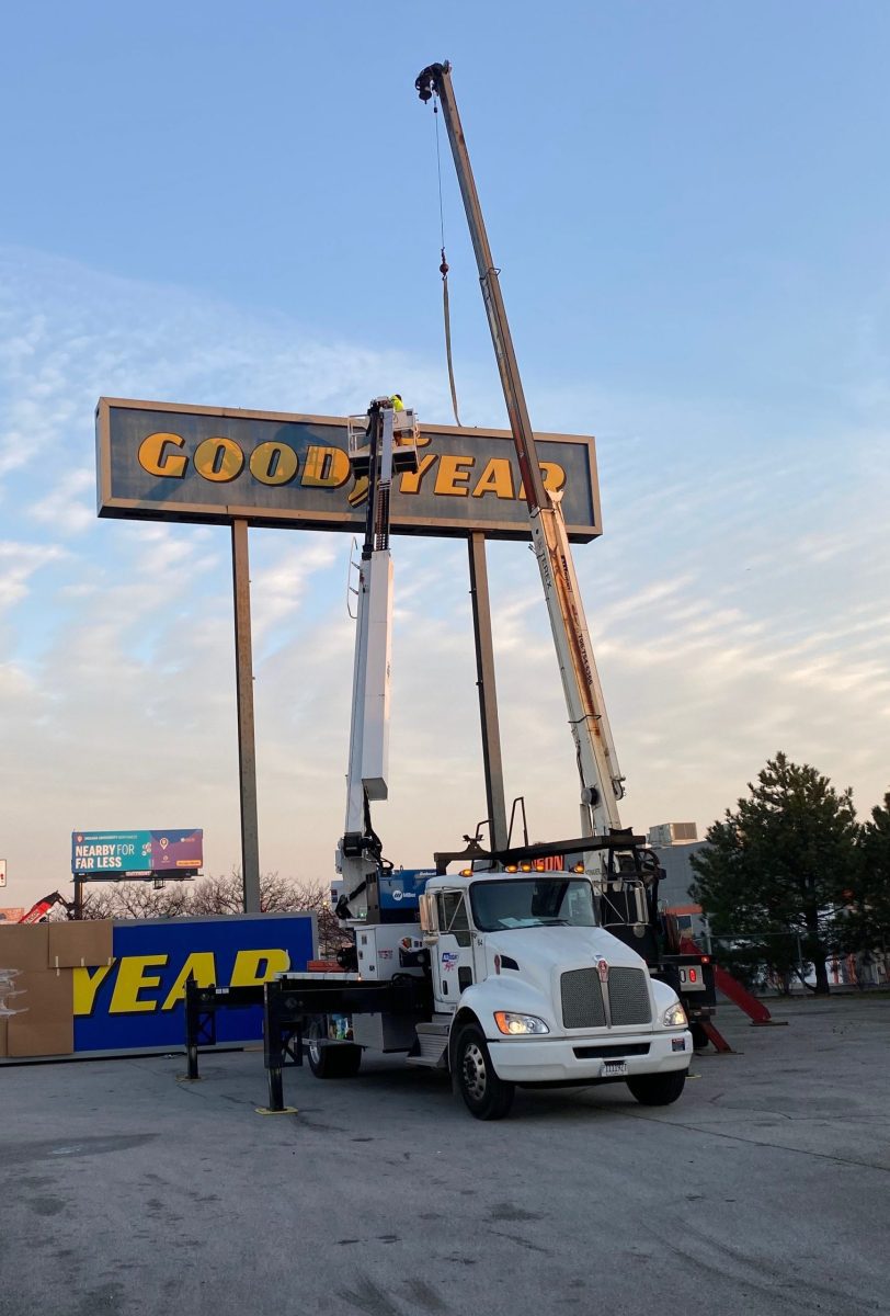 A white truck doing Sign Installation in Tinley Park.