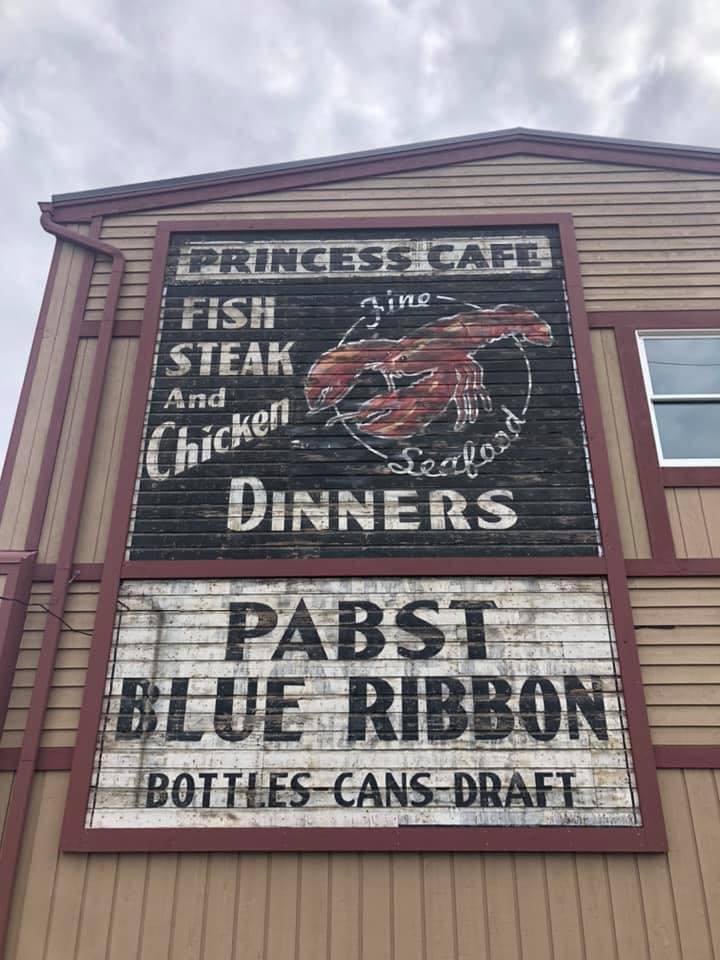 A building with a sign that says princess cafe steak and dinners, created by Joliet Sign Company.